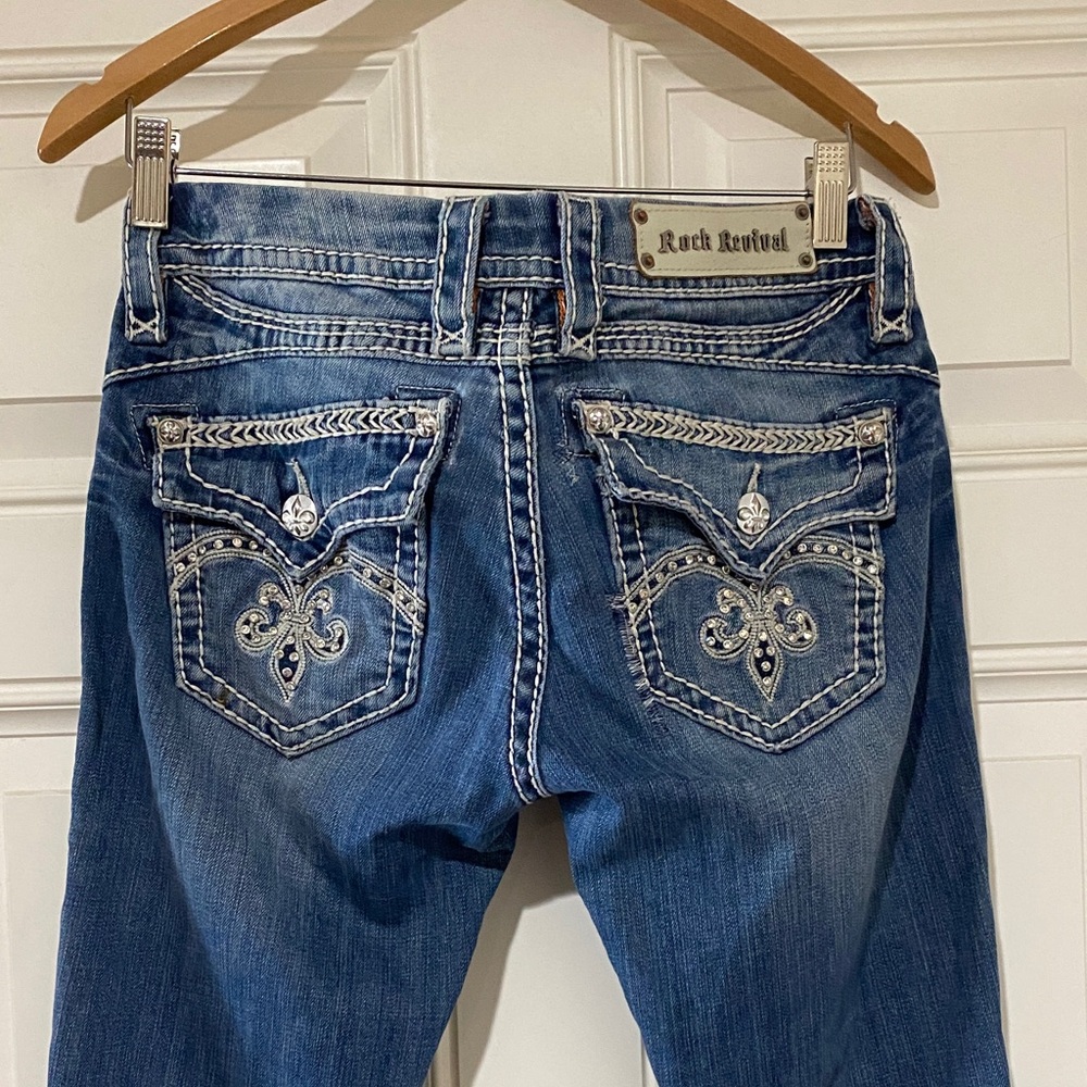 Rock Revival Women's Medium Blue Boot Cut Jeans with Embroidered Fleur-de-Lis